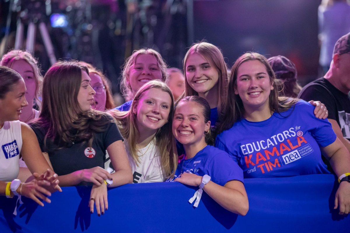 Attendees of the Rally Smile for the Camera at the Harris-Waltz Campaign Rally in Madison. October 30, 2024.