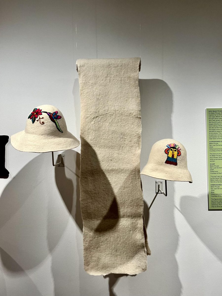 From left to right, Hummingbird Embroidered Hat, Scarf, Embroidered Hat made by Belen Picuasi on display at the "Feel the Beat" exhibition. October 3, 2024. 