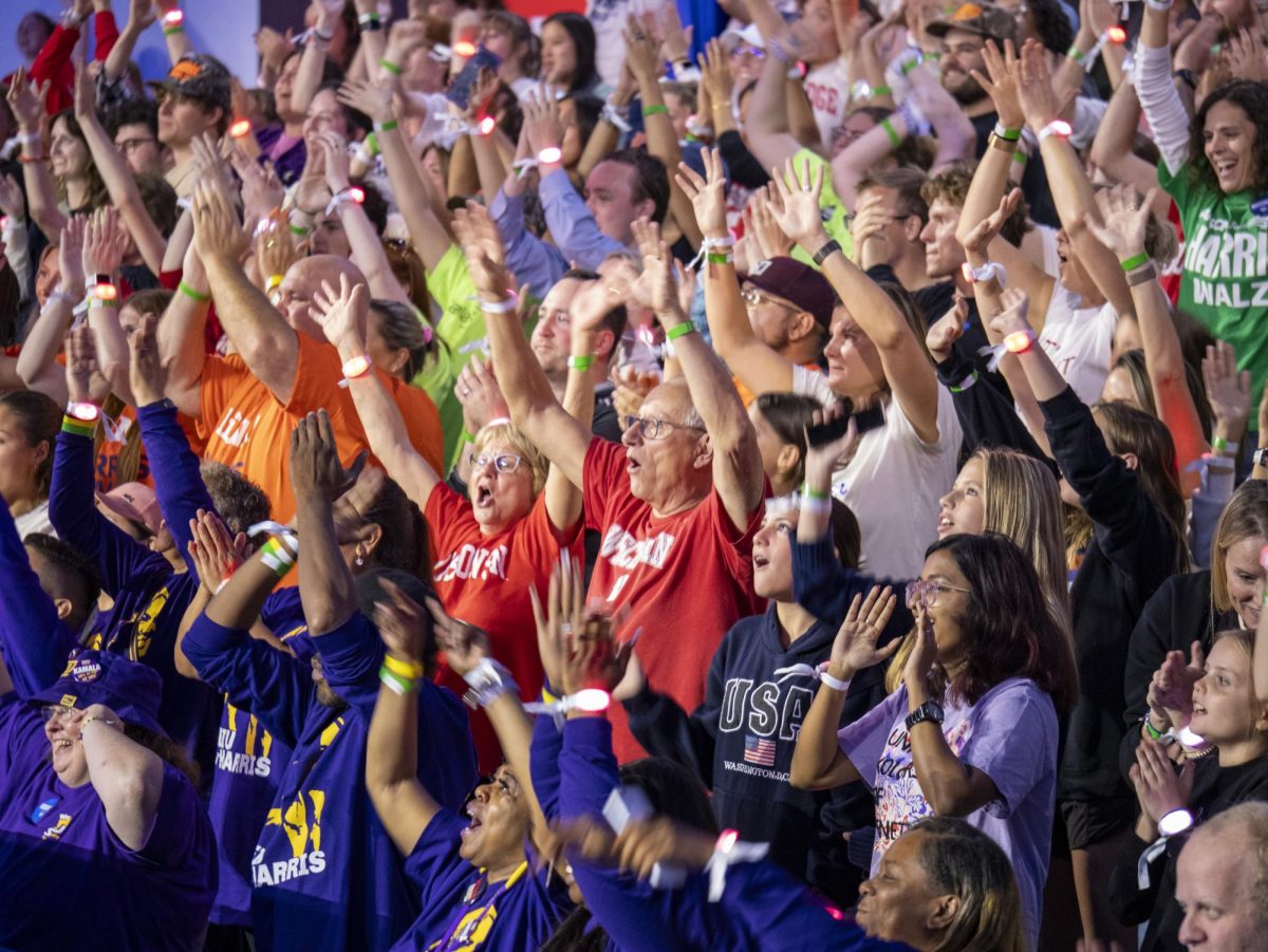 Harris rally attendees cheer.  