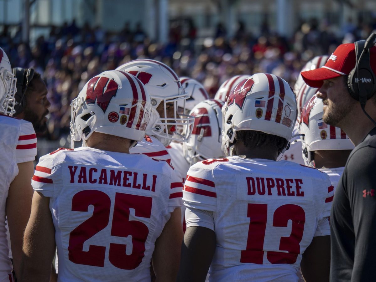 Badger players on the sideline at Northwestern Lakefront football stadium. October 19, 2024. 