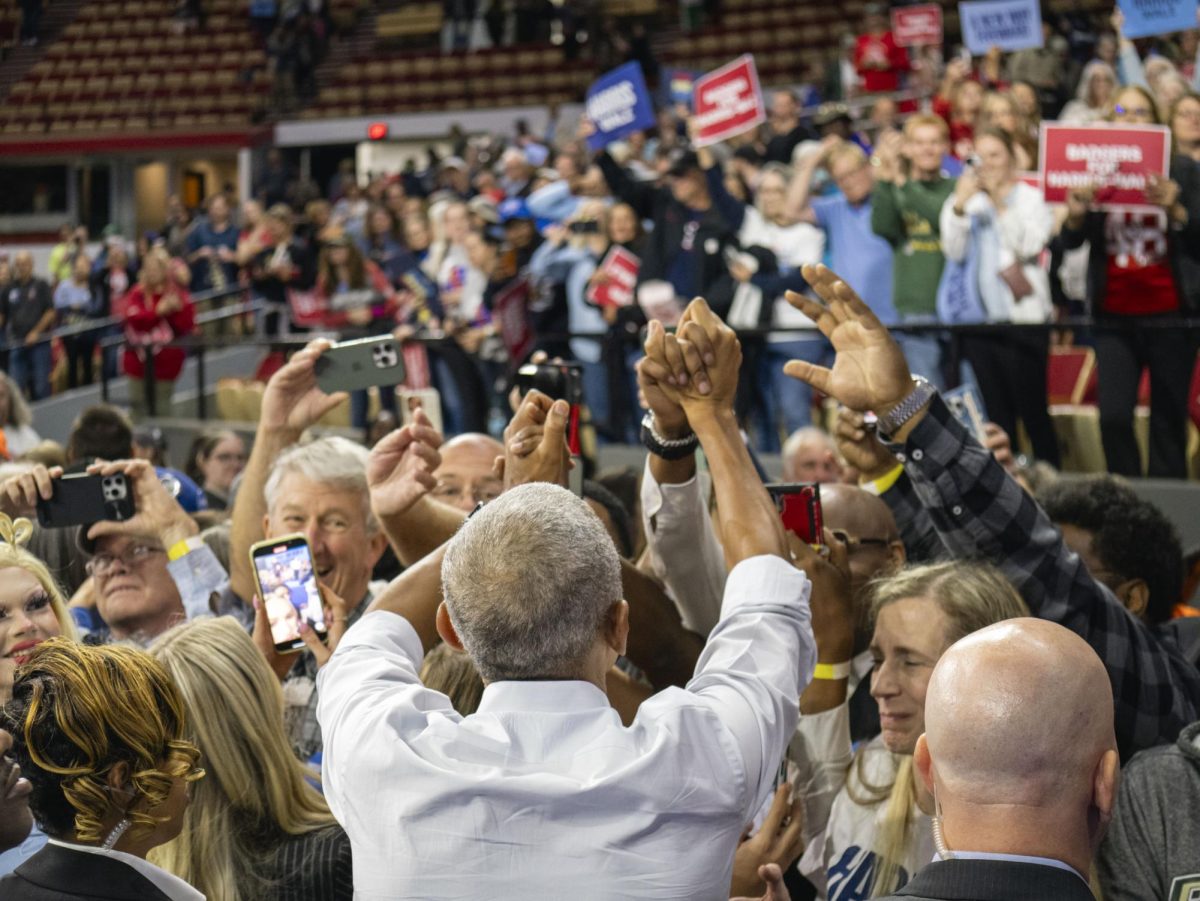 Obama embraces rally attendees. October 22, 2024.