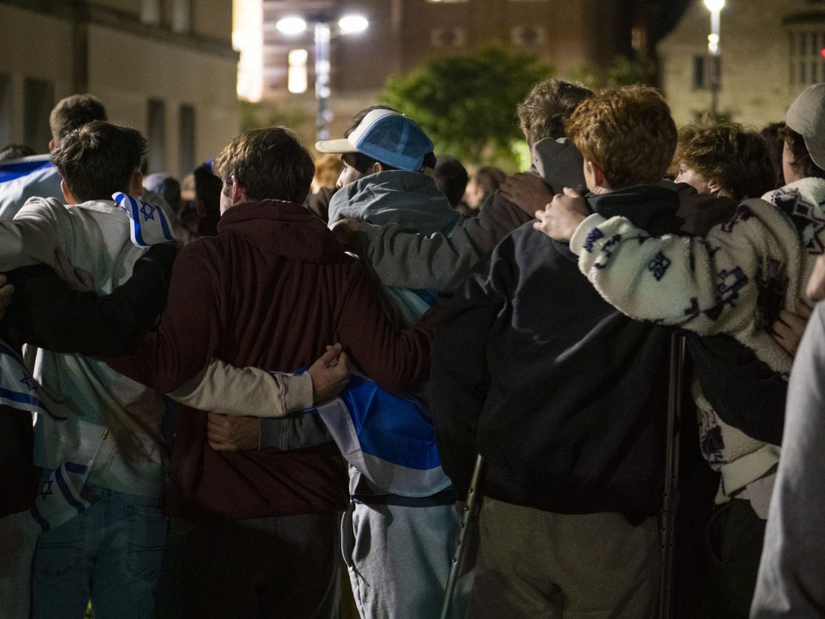 Students embrace at the vigil. 