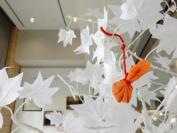 A Tribute Tree created in observance of Orange Shirt Day is filled with tobacco ties at the "Indigenous Art: Reclaiming Space, Reclaiming Stories" exhibit. November 2, 2024.