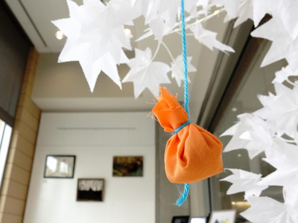 A Tribute Tree created in observance of Orange Shirt Day is filled with tobacco ties at the "Indigenous Art: Reclaiming Space, Reclaiming Stories" exhibit. November 2, 2024.