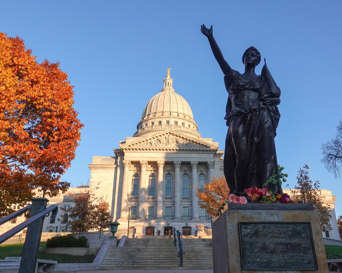 Flowers were left on the "Forward" sculpture after the 2024 election. November 7, 2024.