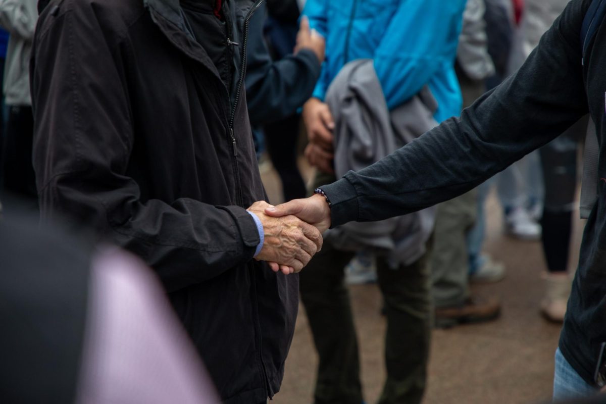 Wisconsin Governor Tony Evers Speaks with a UW Student at an Election Day Meet-And-Greet. November 5, 2024. 