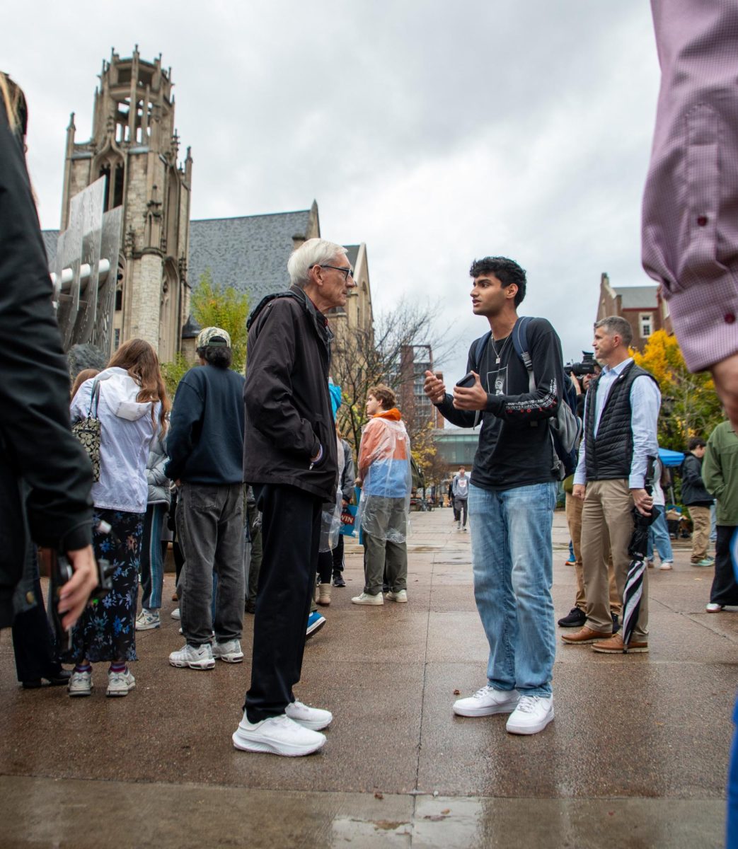 Wisconsin Governor Tony Evers Speaks with a UW Student at an Election Day Meet-And-Greet. November 5, 2024. 