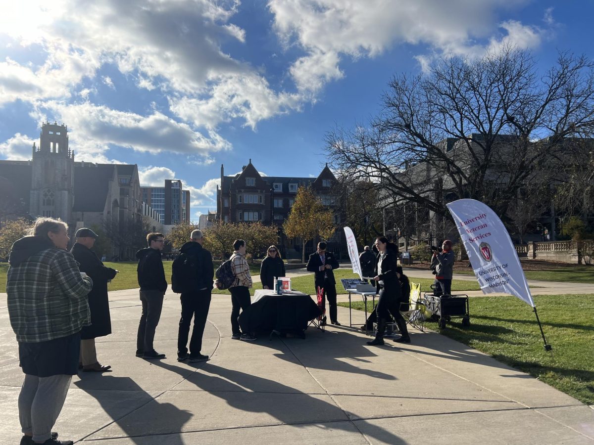 People in line at Library Mall to customize dog tags for Veteran's Day. November 11, 2024.