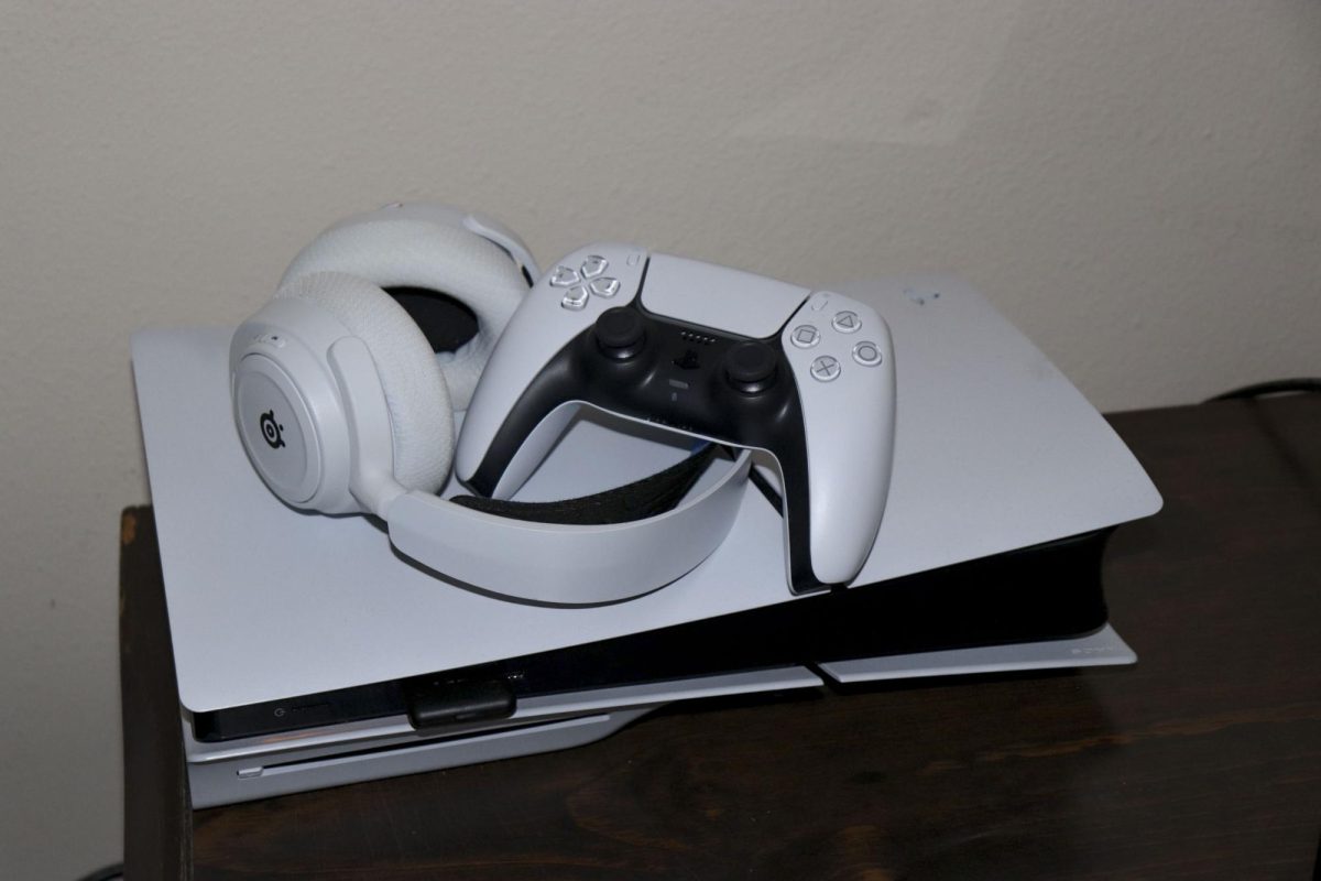 Headphones and a controller on a PS5. November 21, 2024.