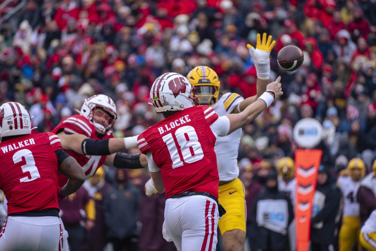 Quarterback Locke throws the ball amidst defensive pressure. November 29, 2024. 