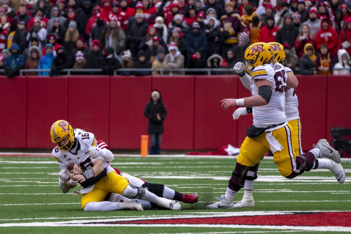 Badgers defender sacks Minnesota's quarterback. November 29, 2024. 