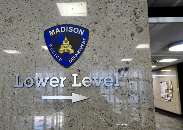 A sign pointing towards the Madison Police Department. January 23, 2025.