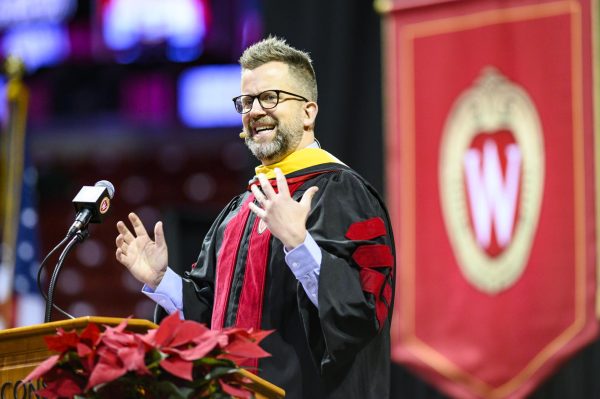 UW alum Jason Gay, the Wall Street Journal's sports and humor columnist, speaks during the winter commencement ceremony held in the Kohl Center at the University of Wisconsin-Madison on Dec. 15, 2019. (Photo by Bryce Richter /UW-Madison)