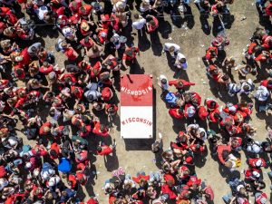 Crowd surrounds a beer die table during Mifflin block party. April 26, 2025.