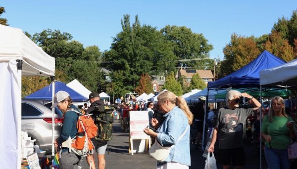 People walking around vendors at the Monroe Street Farmers' Market. August 31, 2025. 
