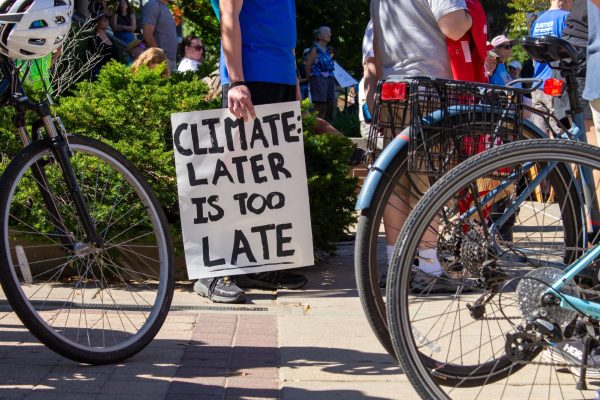 A protester holds a sign during the Wisconsin Climate March. September 28, 2025. 
