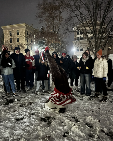 Bucky does headstand at Battle on Bascom snowball fight. December 2, 2025. 