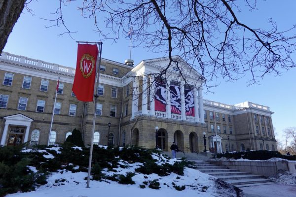 On a cloudless day, a student walks down Bascom Hill. February 4th, 2026.