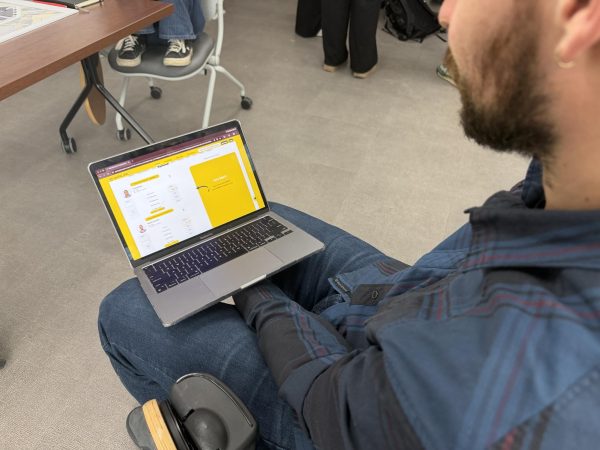 A student has ParlayPlay, a platform where one can play fantasy sports, open on their laptop. March 18, 2026.